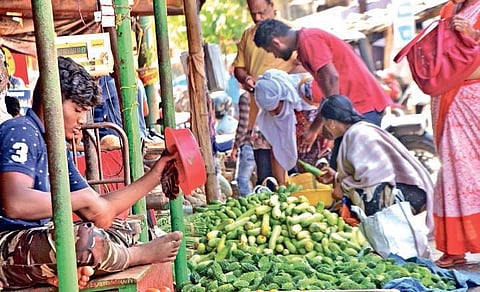 People throng a market to stock up on vegetables in Bhubaneswar on Thursday |EXPRESS