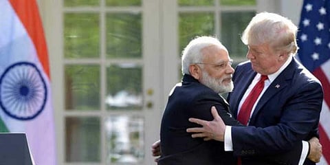 President Donald Trump and Prime Minister Narendra Modi hug in Washington. (Photo | File/AP)
