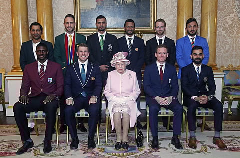 Queen Elizabeth (C) with captains of the ten teams taking part in the World Cup, at the Buckingham Palace before a Royal Garden Party on Wednesday | AP