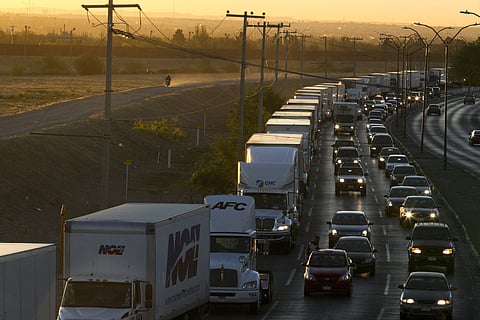 Trucks wait to cross the border with the U.S. in Ciudad Juarez, Mexico (File photo | AP)