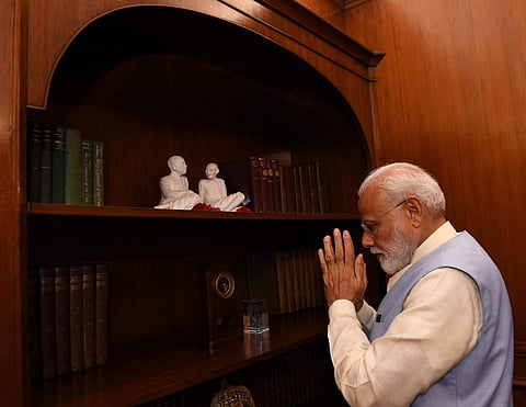 PM Narendra Modi pays tributes to Mahatma Gandhi and Sardar Patel at the Prime Minister's Office in South Block. (Photo | @PIB_India)