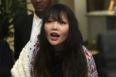 Doan Thi Huong, 30 arrives at Noi Bai international airport in Hanoi, Vietnam. (Photo | AP)