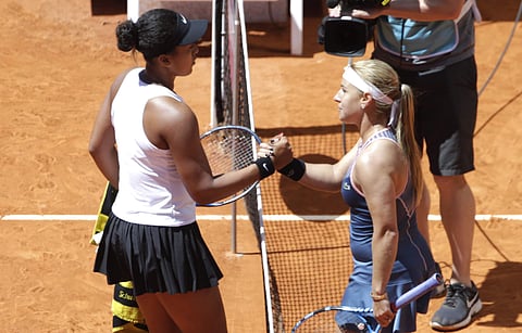 Japan's Naomi Osaka and Slovakia's Dominika Cibulkova shake hands at the end of their math during the Madrid Open tennis tournament. (Photo | AP)