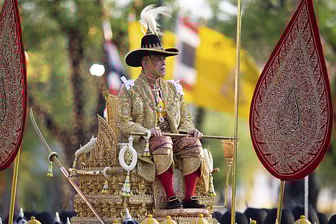 Thailand s King Maha Vajiralongkorn is carried on a palanquin through the streets outside the Grand Palace for the public to pay homage during the second day of his coronation ceremony in Bangkok on Sunday. (Photo | AP)