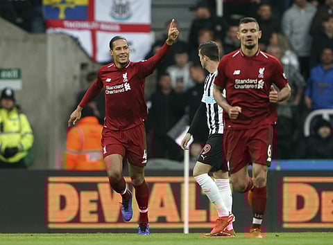 Liverpool strike late to go top, nine-man Spurs beaten at Bournemouth