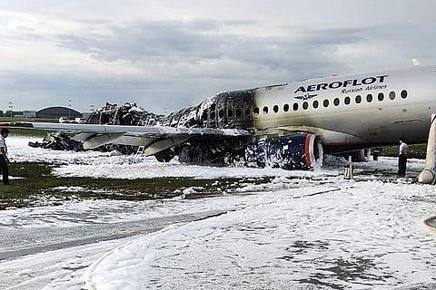 The Sukhoi SSJ100 aircraft of Aeroflot airlines is covered in fire retardant foam after an emergency landing in Sheremetyevo airport in Moscow, Russia, Sunday, May 5, 2019. (Photo | AP)
