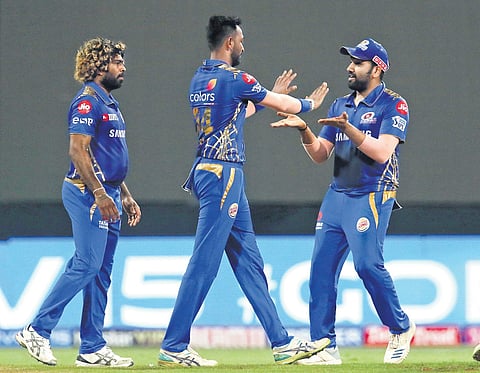 Mumbai players celebrate the dismissal of Kolkata Knight Riders skipper Dinesh Karthik on Sunday | SPORTZPICS
