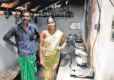 Jalaja and her husband Vijayan with the biogas stove at their house | Express