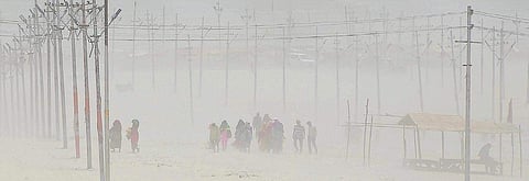 Pilgrims return after taking a holy dip on a hot, summer day in Prayagraj (Allahabad). Allahabad will vote on May 12 in the sixth phase of Lok Sabha polls | PTI