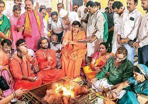 BJP candidate Sadhvi Pragya Singh Thakur performs rituals at Lord Parshuram Temple on the occasion of Parshuram Jayanti in Bhopal on Tuesday | PTI