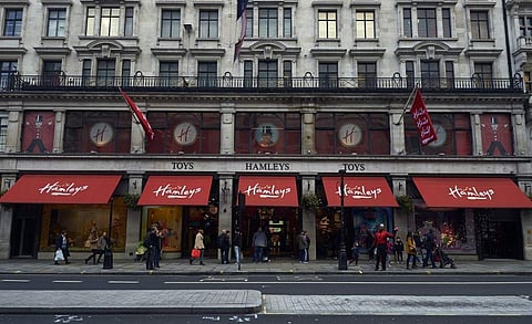 People walk past The Hamleys toy store on Regent Street in central London (File Photo| AFP)