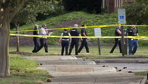 Police work the scene where eleven people were killed during a mass shooting at the Virginia Beach city public works building. (Photo | AP)