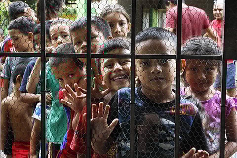 Migrant children line up for a meal at the door of the Jesus del Buen Pastor del Pobre y el Migrante shelter, in Tapachula, Chiapas state, Mexico. (Photo | AP)