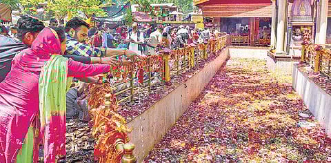 Kashmiri Pandits offer prayers during the annual fair at Kheer Bhawani Temple in Tulmulla of Ganderbal district on Monday. | PTI