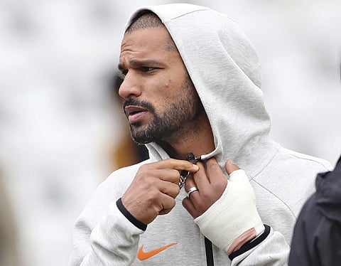 India's Shikhar Dhawan is seen with his left hand covered with a cast during team's training session ahead of their Cricket World Cup match against New Zealand at Trent Bridge in Nottingham. (Photo | AP)