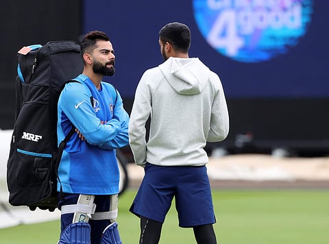 Indian captain Virat Kohi with Khaleel Ahmed after batting in the nets during a training session ahead of their Cricket World Cup match against New Zealand at Trent Bridge. (Photo | AP)