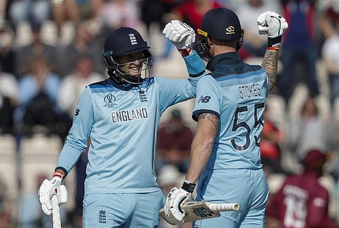 England's Joe Root (L) and England's Ben Stokes celebrate after victory in the 2019 Cricket World Cup group stage match between England and West Indies at the Rose Bowl in Southampton (Photo | AFP)
