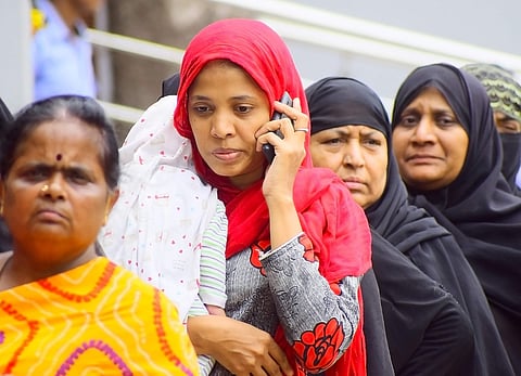 Family investors seen outside IMA Jewels at Shivajinagar in Bengaluru. (Photo | Pandarinath B, EPS)