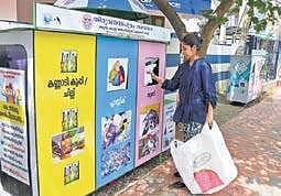 A city resident dropping cloth waste at the newly set up dry waste segregated collection hub B P Deepu