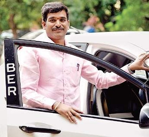 Mallappa V Pattar, a part-time cab driver, has an MA degree in Sanskrit. (Photo | Nagaraja Gadekal)