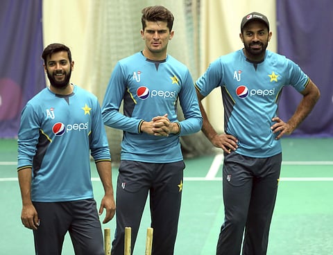 Imad Wasim with Shaheen Afridi and Wahab Riaz. (Photo | AP)