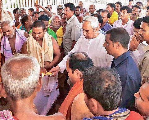 CM Naveen Patnaik offering prayers at Baladevjew temple on Monday. (Photo | EPS)