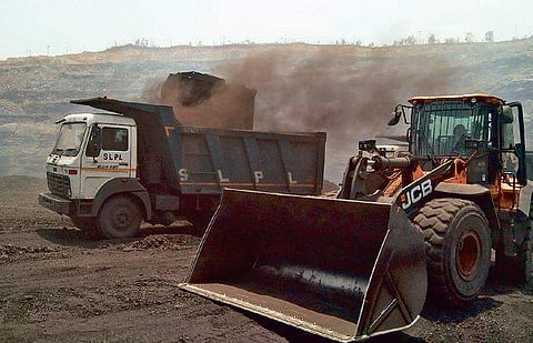Vehicles loading coal in Ib valley coalfields I Express