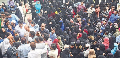 Parents and students of Government VK Obaidullah School in Shivajinagar staged a protest in front of the school demanding that teachers be reinstated, in Bengaluru on Wednesday |Photos: Pandarinath B