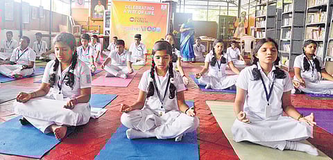 Students participating in a yoga session organised by The New Indian Express at Chinmaya Vidyalaya in Vazhuthacaud, Thiruvananthapuram, as part of Yoga Day celebrations on Wednesday | Vincent Pulickal