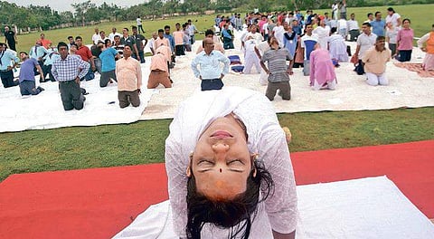 An instructor teaching asana on Utkal University campus. ( Photo | EPS)