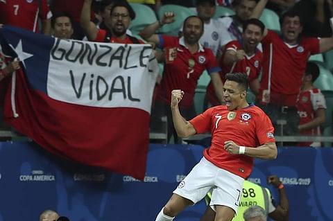 Chile's Alexis Sanchez celebrates after scoring his side's second goal against Ecuador during a Copa America Group C soccer match at the Arena Fonte Nova in Salvador , Brazil. (Photo | AP)