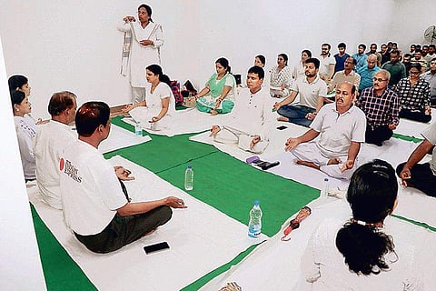 Staff of The New Indian Express participate in a Yoga session on the office premises at Mancheswar in Bhubaneswar on June 21. ( Photo | EPS)