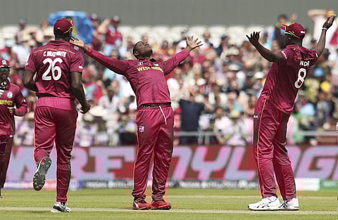 West Indies' Sheldon Cottrell celebrates after dismissing New Zealand's Colin Munro during the Cricket World Cup match between New Zealand and West Indies at Old Trafford in Manchester. (Photo | AP)