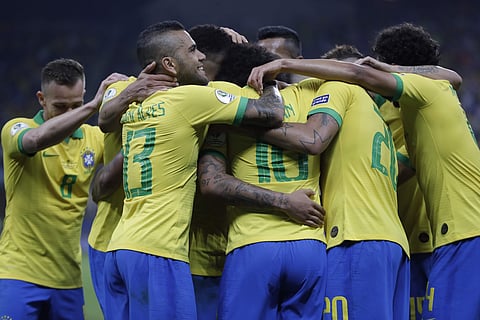 Brazil's Willian, center, celebrates scoring his side's 5th goal with teammates during a Copa America match against Peru. (Photo | AP)