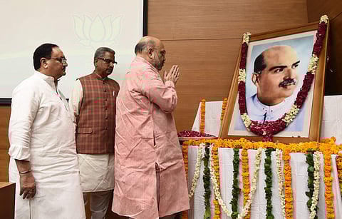 Union minister and BJP President Amit Shah along with party working president J P Nadda pays homage to Jansangh founder Syama Prasad Mookerjee on his martyrdom day at BJP headquarters in New Delhi Sunday. | (Parveen Negi | EPS)