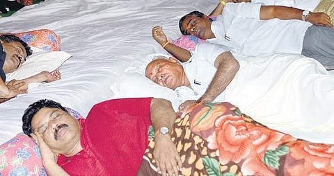 BJP leaders catch a few winks during a protest in the city against the government’s decision to sell the leased land to JSW Steel.