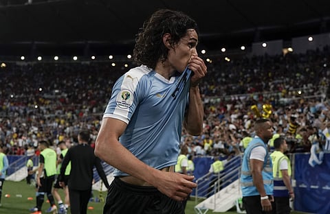 Uruguay's Edinson Cavani celebrates after scoring his side's opening goal during a Copa America Group C soccer match against Chile at the Maracana stadium in Rio de Janeiro, Brazil. (Photo | AP)