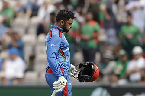 Afghanistan's captain Gulbadin Naib walks off the field of play after losing his wicket from the bowling of Bangladesh's Shakib Al Hasan during the Cricket World Cup match between Bangladesh and Afghanistan at the Hampshire Bowl in Southampton. (Photo | A