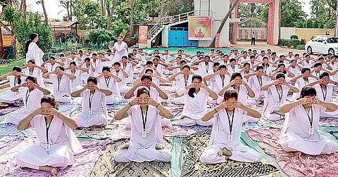 Students of Royal College of Science and Technology performing Yoga in Bhubaneswar on Monday. ( Photo | EPS)