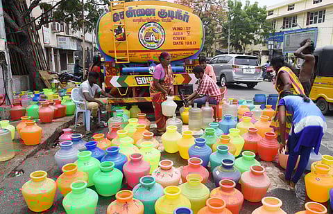 People lined up the empty water pots to fetch water at Chintadripet in Chennai on Tuesday. (R Sathish Babu | EPS)