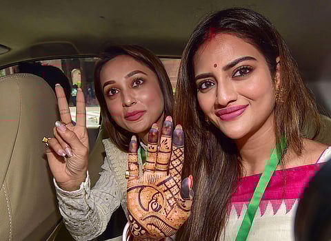 Actors and Trinamool Congress (TMC) MPs Mimi Chakraborty and Nusrat Jahan (R) at Parliament House complex during the Budget Session, in New Delhi, Tuesday, June 25, 2019. (Photo | PTI)