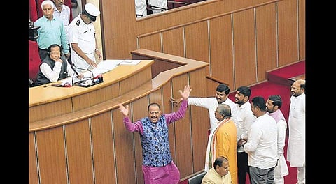 Congress MLAs stage a protest in the well of the House on Tuesday. ( Photo | EPS)