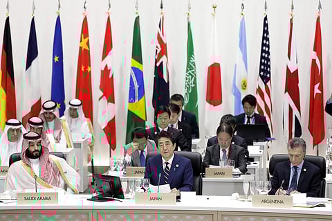 Japan's Prime Minister Shinzo Abe, front row center, speaks while Saudi Crown Prince Mohammed bin Salman, front row left, and Argentina's President Mauricio Macri, front row right, listen during a working lunch at the G20 summit in Osaka, Japan. ( Photo |