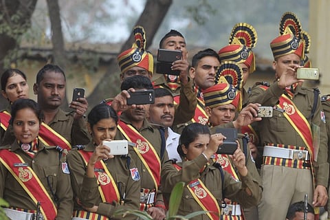 A file photo of Indian Railway Protection Force (RPF) personnel take photographs during Republic Day celebrations. (Photo | AFP)