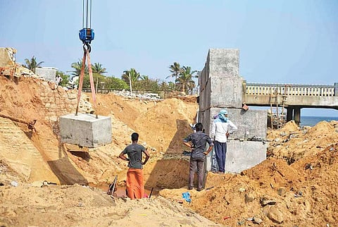 The ongoing construction of the double-layered seawall and Valiyathura pier