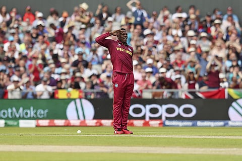 Cottrell celebrates every dismissal of his with a short march and a salute to the pavilion as a tribute to the Jamaican Armed Forces. He is a soldier in the Jamaican Defence Force. | AP