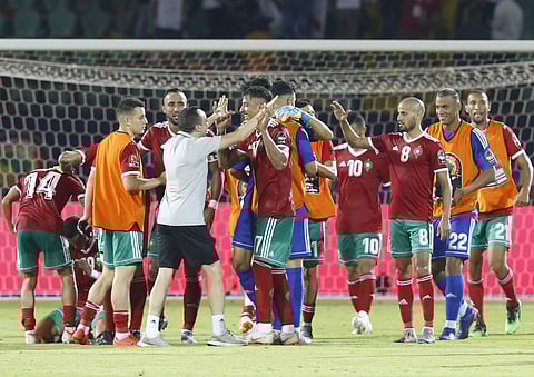 Moroccan players celebrate after defeating Ivory Coast in the African Cup of Nations. (Photo | AP)