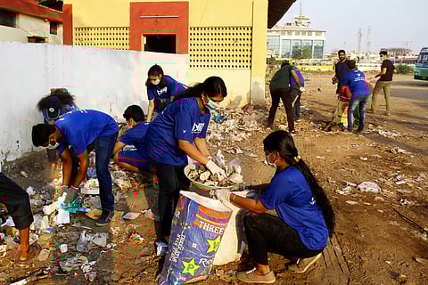 Members of Ayudh involved in a clean-up drive near K10 Police Station, Koyembedu on Sunday. (Photo | Debadatta Mallick, EPS)