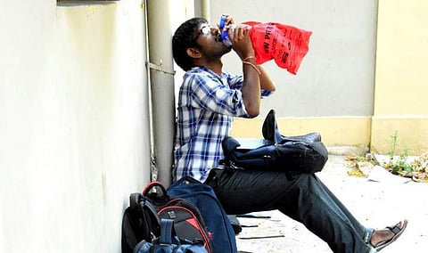 A UPSC aspirant drinking water on a hot summer day at an exam centre in Tirupati on Sunday. Maximum temperature of the day was recorded at Tirupati and Jangamaheswarapuram at 44 degree Celsius | Madhav K