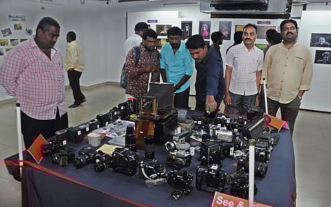 Visitors takes a look at the displayed cameras from oldest to newest during the World Camera Day at Cultural center in Vijayawada on Saturday (Express| Prashant Madugula)